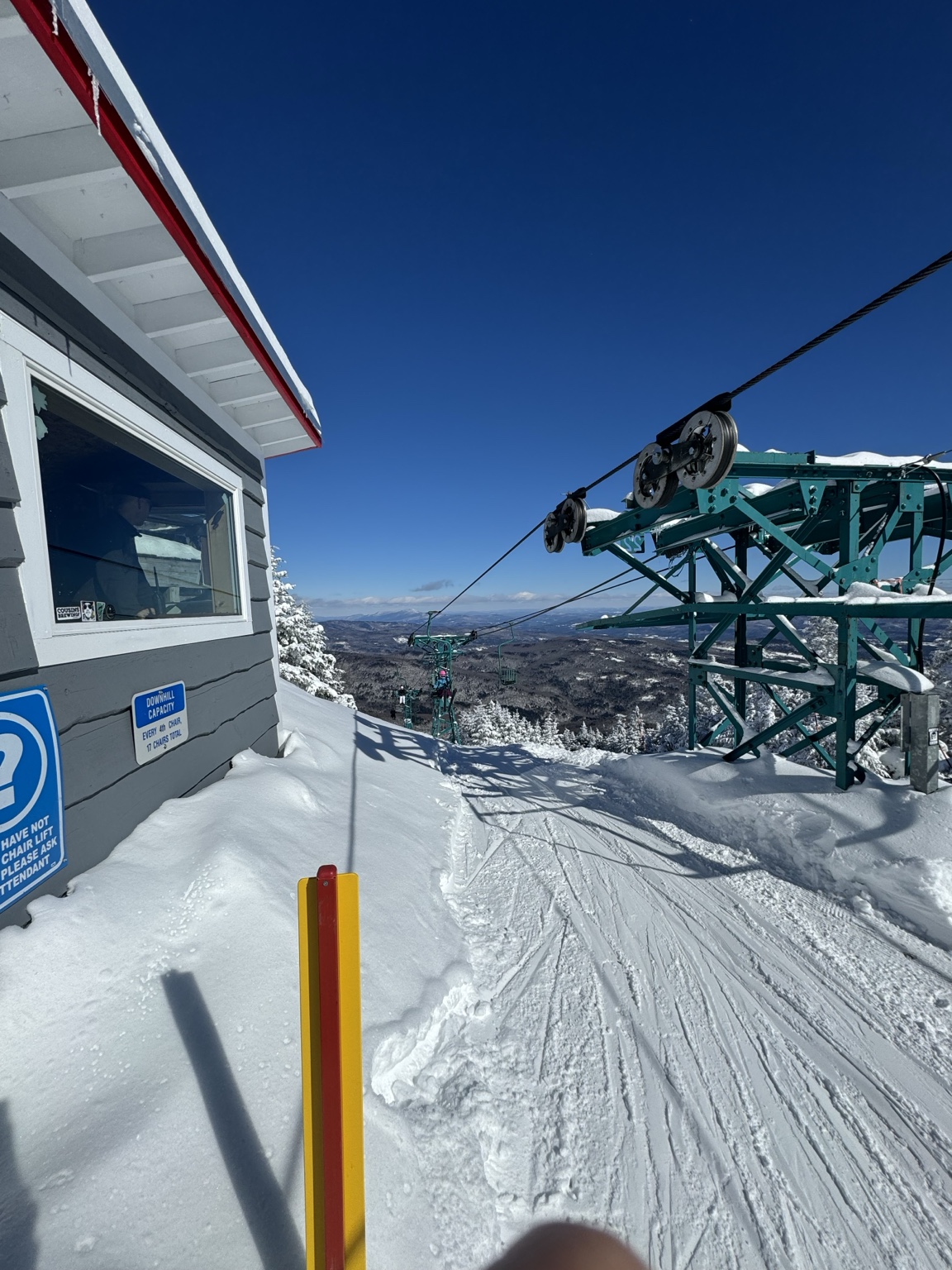 Snow-covered chairlift at Mad River Glen